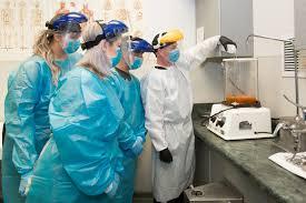 image of students learning how mortuary equipment works