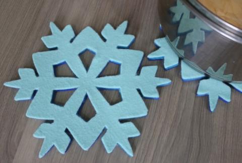 Felt snowflake laying on table