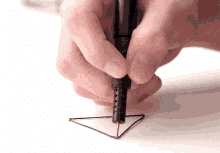 3D pen drawing triangle shape, then lifting pen to turn triangle 3D