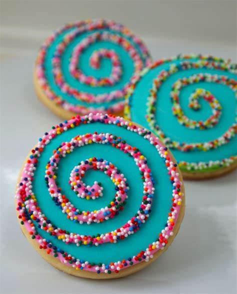 Cookies decorated with a swirl and sprinkles
