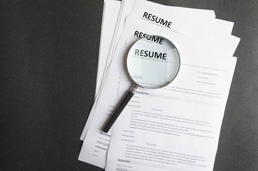 Resume with a magnifying glass on top